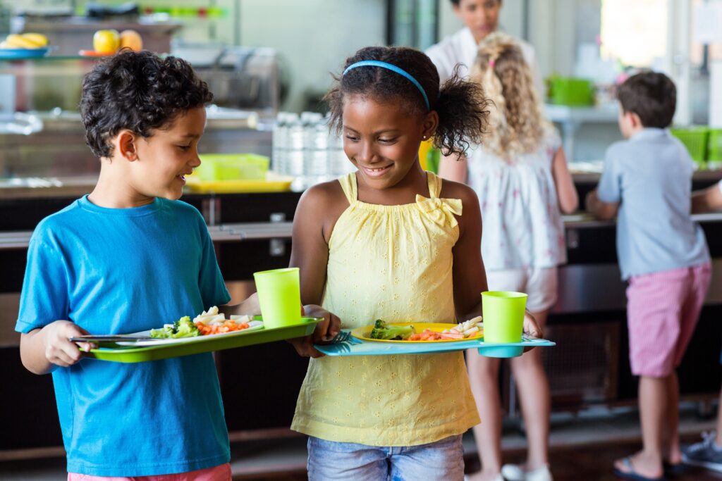 Children holding healthy lunch trays that have been minimally processed or unprocessed food that is ‘locally grown,’ ‘locally raised,’ or ‘locally caught.’
by: WavebreakmediaMicro