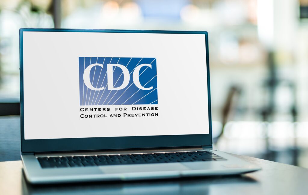 Computer sitting on table with CDC logo on screen.
Picture by Monticello.