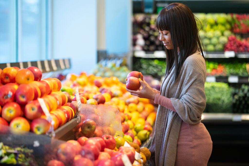 Woman shopping for apples in the produce department of a grocery store
By Mat Hayward