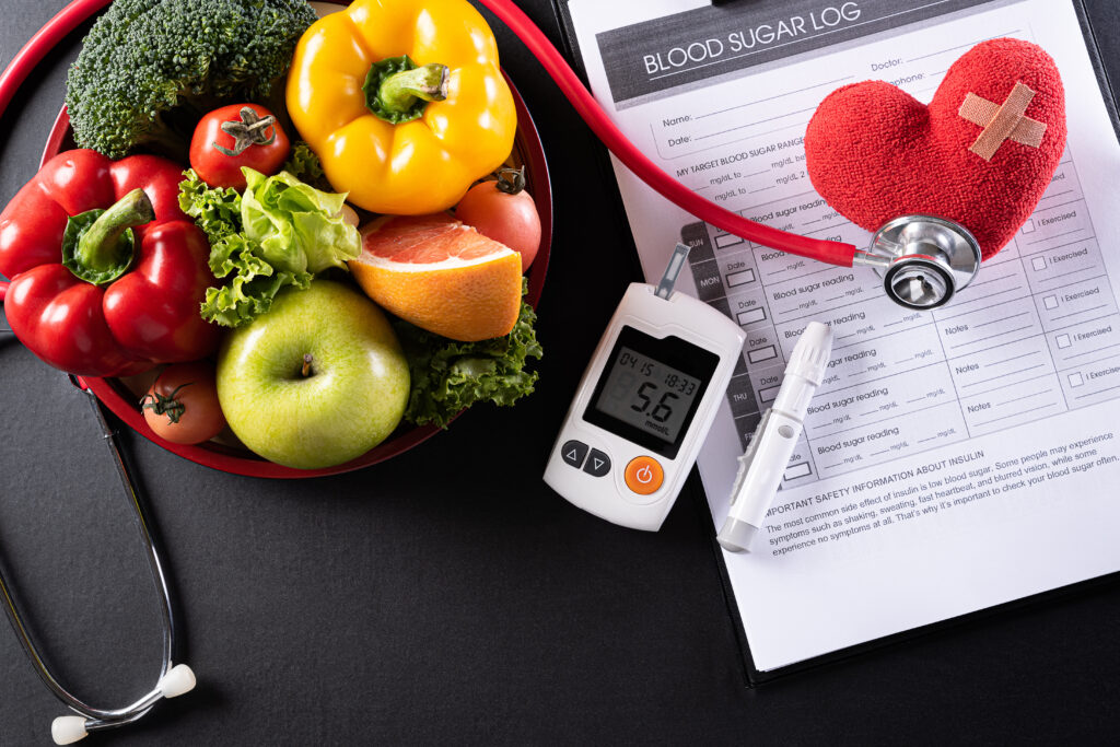World diabetes day and healthcare concept. Patient's blood sugar control, diabetic measurement, and healthy food eating nutrition with red heart on black background.
By Siam